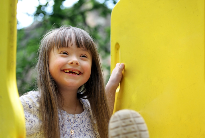 Portrait of a smiling girl playing