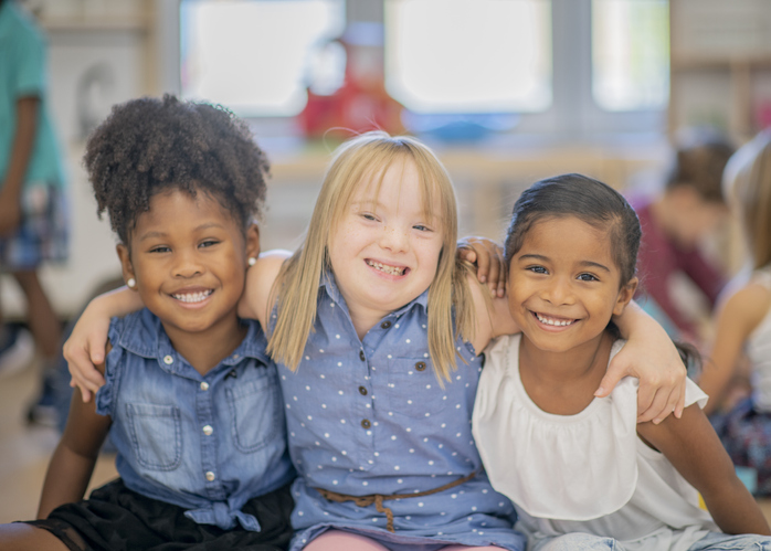 Three diverse friends at kindergarten